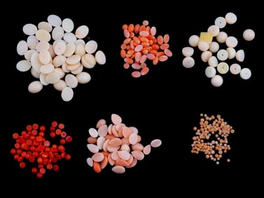 COLLECTION OF MIXED CORAL CABOCHONS AND BEADS
