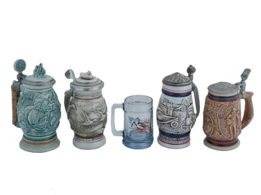 FIVE AMERICAN CERAMIC STEINS W DIFFERENT DESIGNS