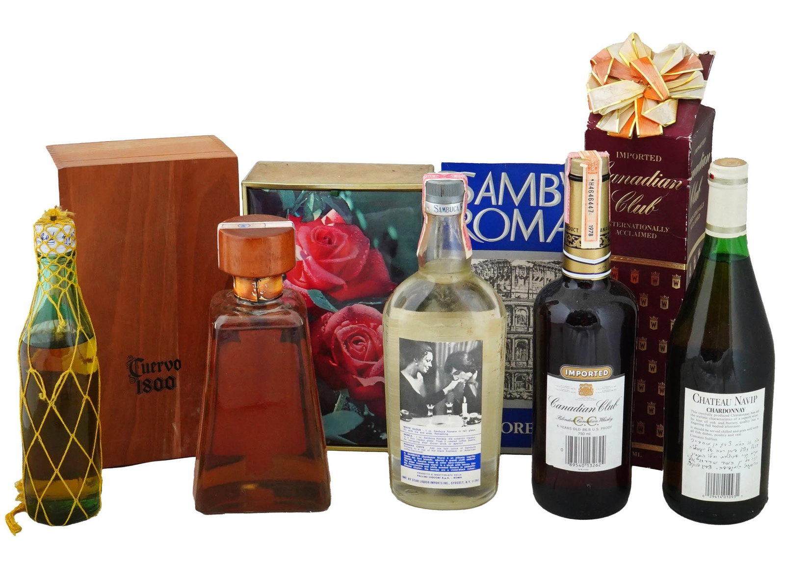 VTG BOTTLES OF ALCOHOLIC DRINKS FROM RENOWNED BRANDS: A collection of bottles with alcoholic beverages from renowned brands, offering a selection of spirits and vintage wine, including Brugal Anejo Ron Superior, Cuervo 1800 Anejo Tequila, and Romana Samb