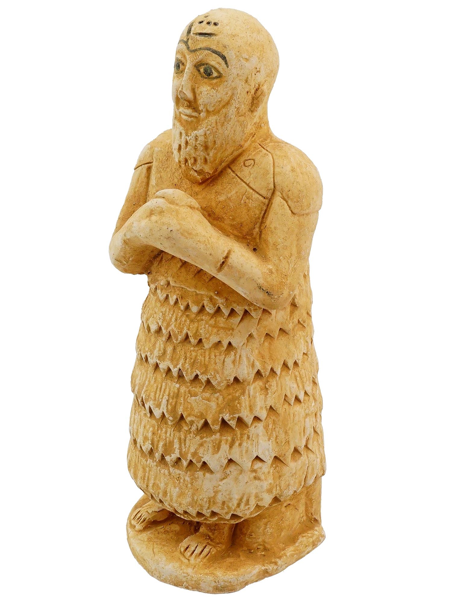 ANTIQUE GRAND TOUR SUMERIAN POTTERY IDOL FIGURINE: A hand build pottery idol representing a human figurine, a Grand Tour reproduction of an ancient Sumerian piece. The figure has a beard with painted face and standing with his hands clasped in front o