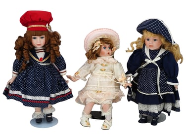 THREE VINTAGE PORCELAIN DOLLS WITH STANDS