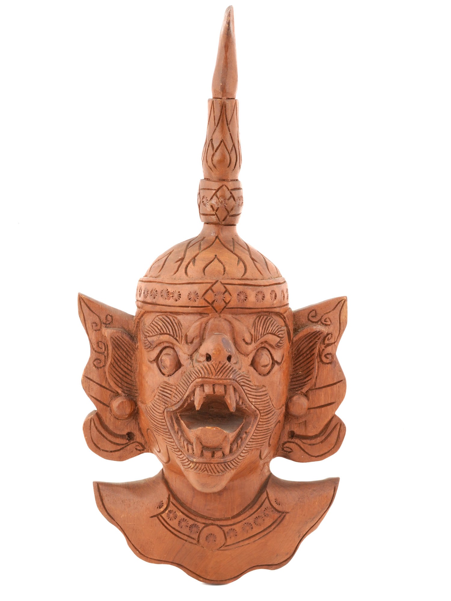 VINTAGE SOUTHEAST ASIAN CARVED WOOD WALL MASK: A vintage Southeast Asian carved wood wall mask. The mask features a well detailed face with a frightening expression. High headdress with a pointed top. The backside is flat. This type of carved item
