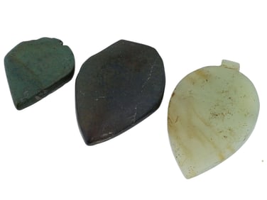 THREE ANCIENT HAND CARVED POLISHED STONE PENDANTS