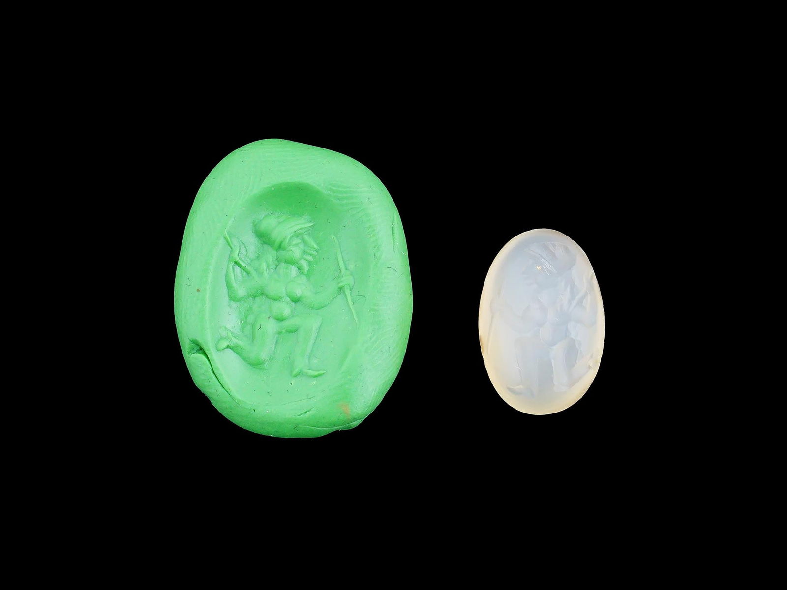 CARVED STONE INTAGLIO ANCIENT ROMAN IMAGE HUMAN FIGURE: A carved stone intaglio featuring an ancient Roman image of an armed human figure. Such intaglios were used as personal seals, amulets, or decorative jewelry, showcasing the Romans appreciation for my