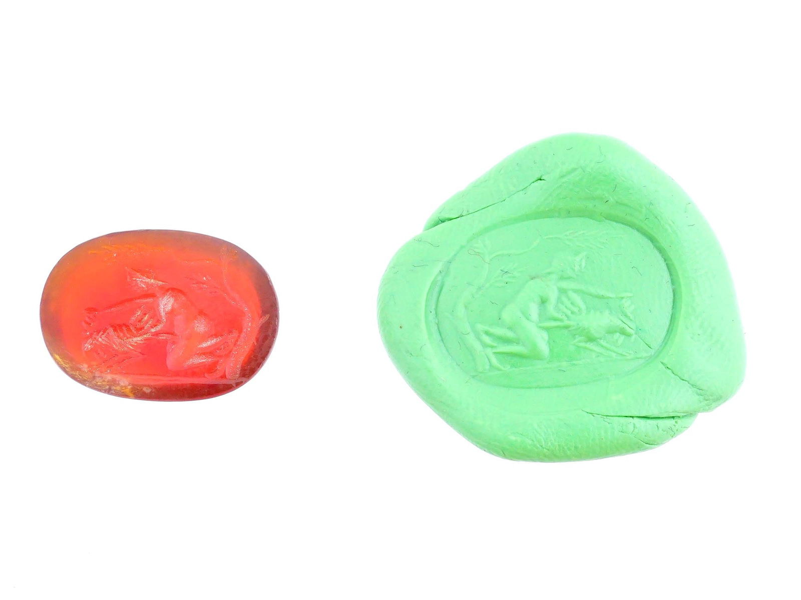 CARVED STONE INTAGLIO WITH ANCIENT ROMAN EROTIC SCENE: A carved stone intaglio featuring a detailed ancient Roman erotic scene. Such intaglios were used as personal seals, amulets, or decorative jewelry, showcasing the Romans appreciation for mythology an