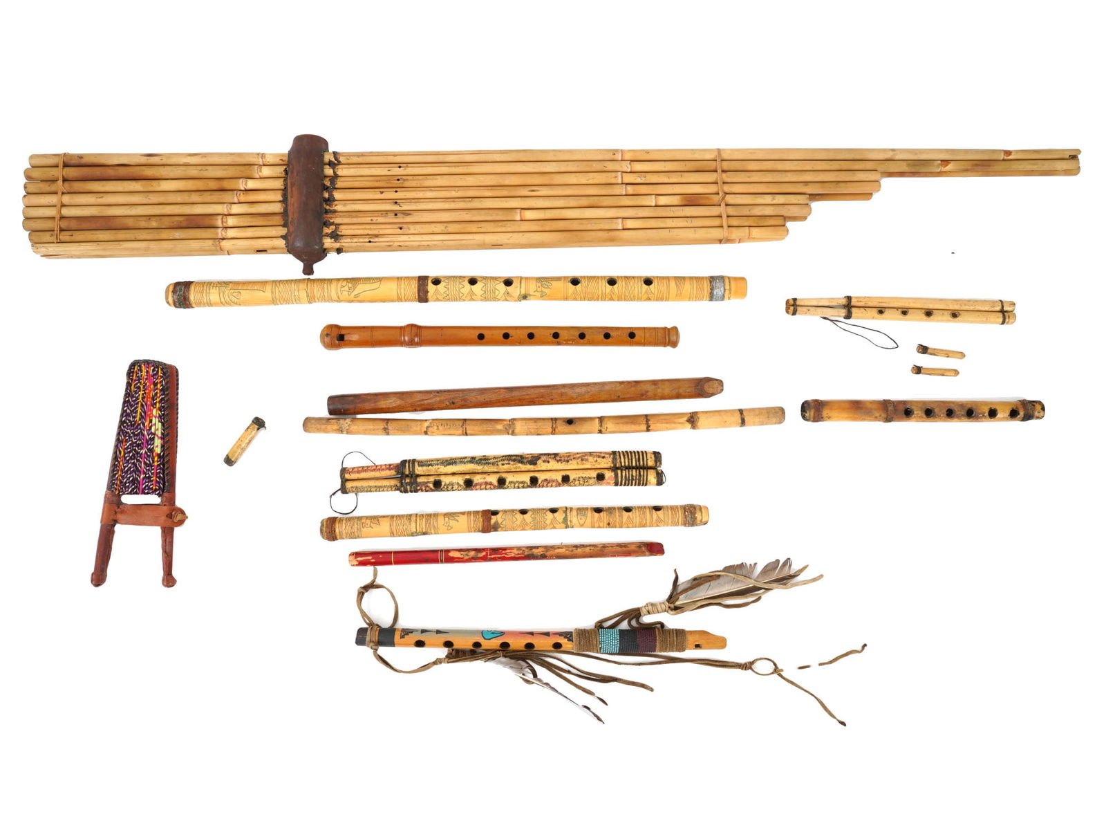COLLECTION OF VARIOUS VINTAGE BAMBOO FLUTES: A collection of diverse assortment of bamboo flutes, showcasing the rich musical tradition associated with these instruments. The lot includes a variety of flutes in different lengths and styles such