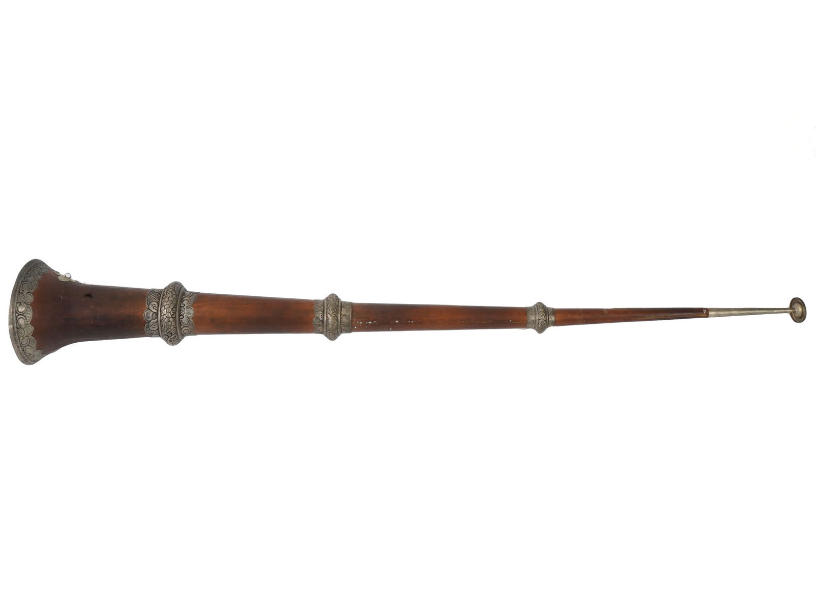 INDIAN CEREMONIAL TELESCOPIC HORN W EMBOSSED DESIGN: An Indian ceremonial telescopic horn. The horn has a long, conical shape. It is made of metal, decorated with embossed bands adorned with floral design. Vintage And Antique Musical Instruments, and Co