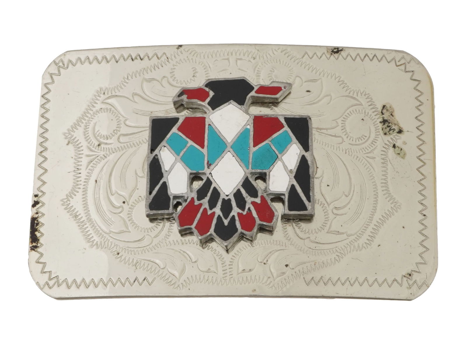 AMERICAN NICKEL SILVER TURQUOISE CORAL BELT BUCKLE: A vintage American Navajo style nickel silver belt buckle. Etched ornaments and eagle motif set with turquoise and red coral. Unmarked. Weight: 75 grams. Tribal Jewelry, Silverware, Accessories.LOT CO