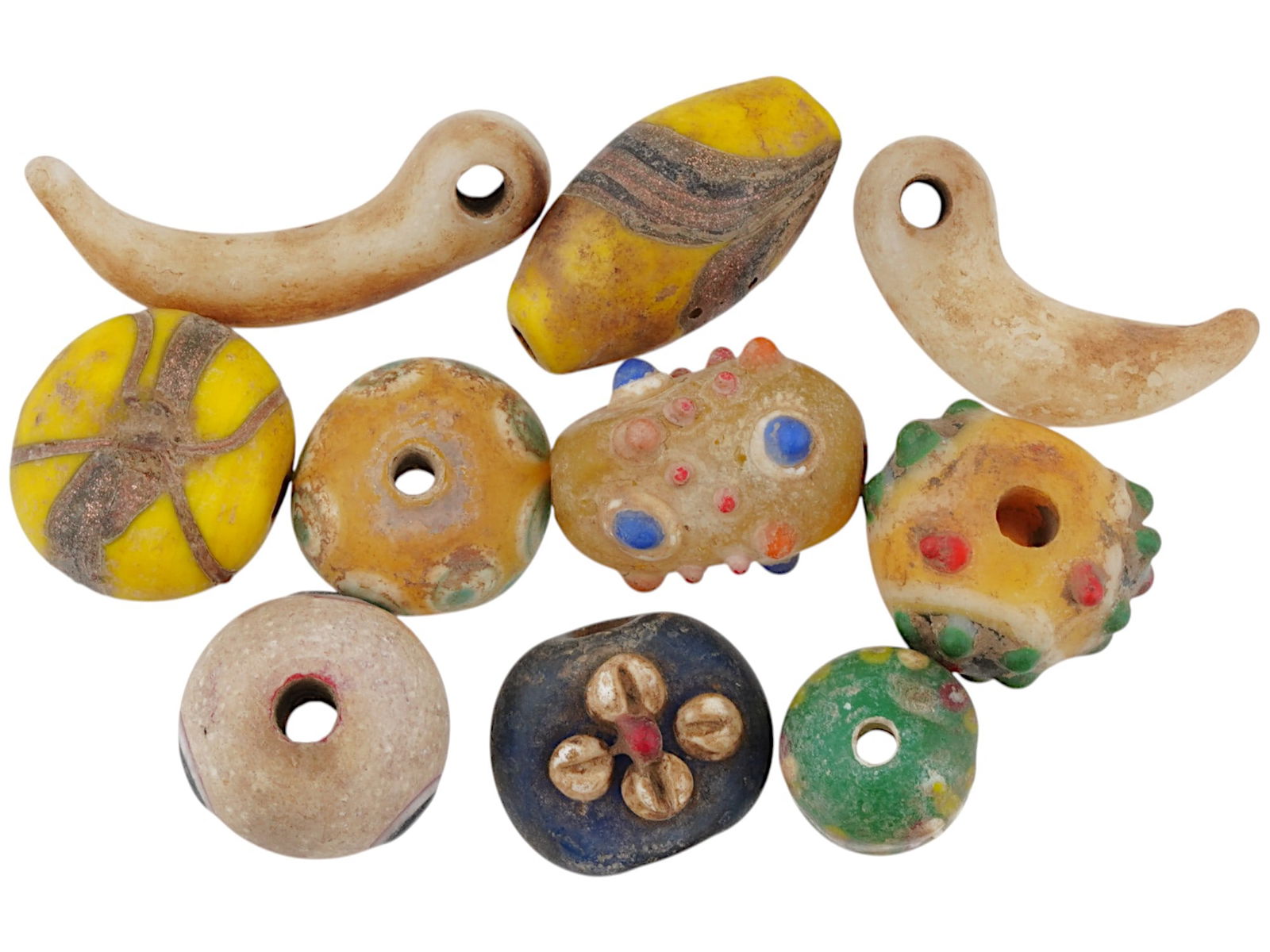 ANCIENT PHOENICIAN GLASS MOSAIC BEADS CA 5TH TO 3RD BC: A collection of ancient Phoenician glass mosaic beads, spanning from the 5th to the 3rd centuries BC, representing a fascinating glimpse into the artistry and craftsmanship of the Phoenician civilizat