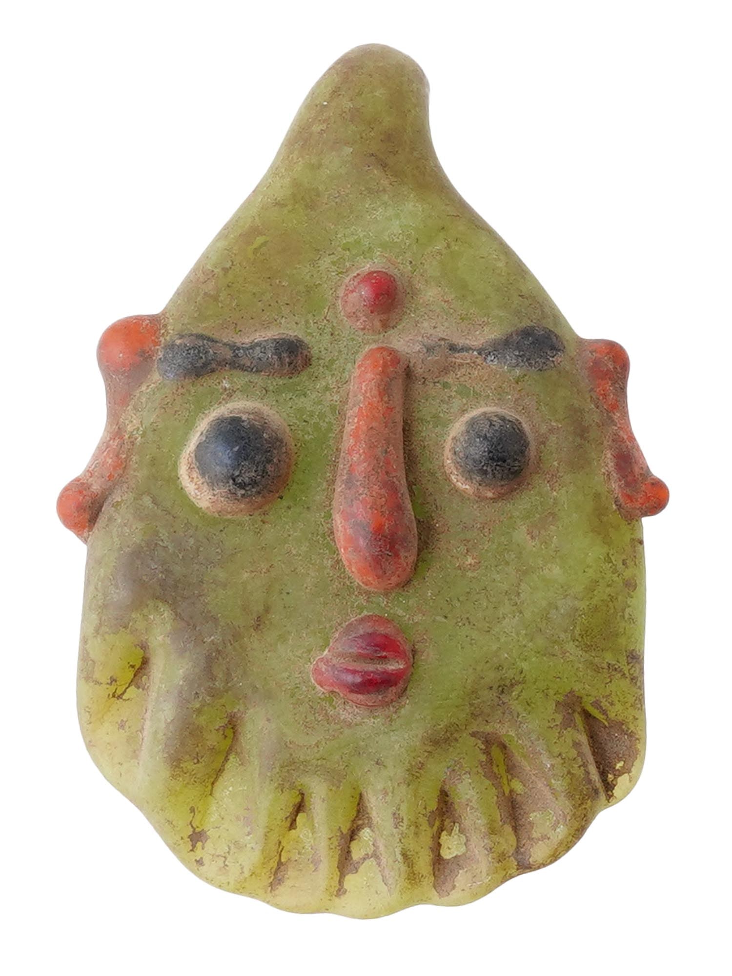 ANCIENT PHOENICIAN MOZAIC GLASS HEAD PENDANT: An ancient Phoenician glass amuletic head pendant with applied mosaic detailing in green and red and a large hanging ring. Circa 400 to 200 BC. Pendants in the form of human or demonic heads, presumab