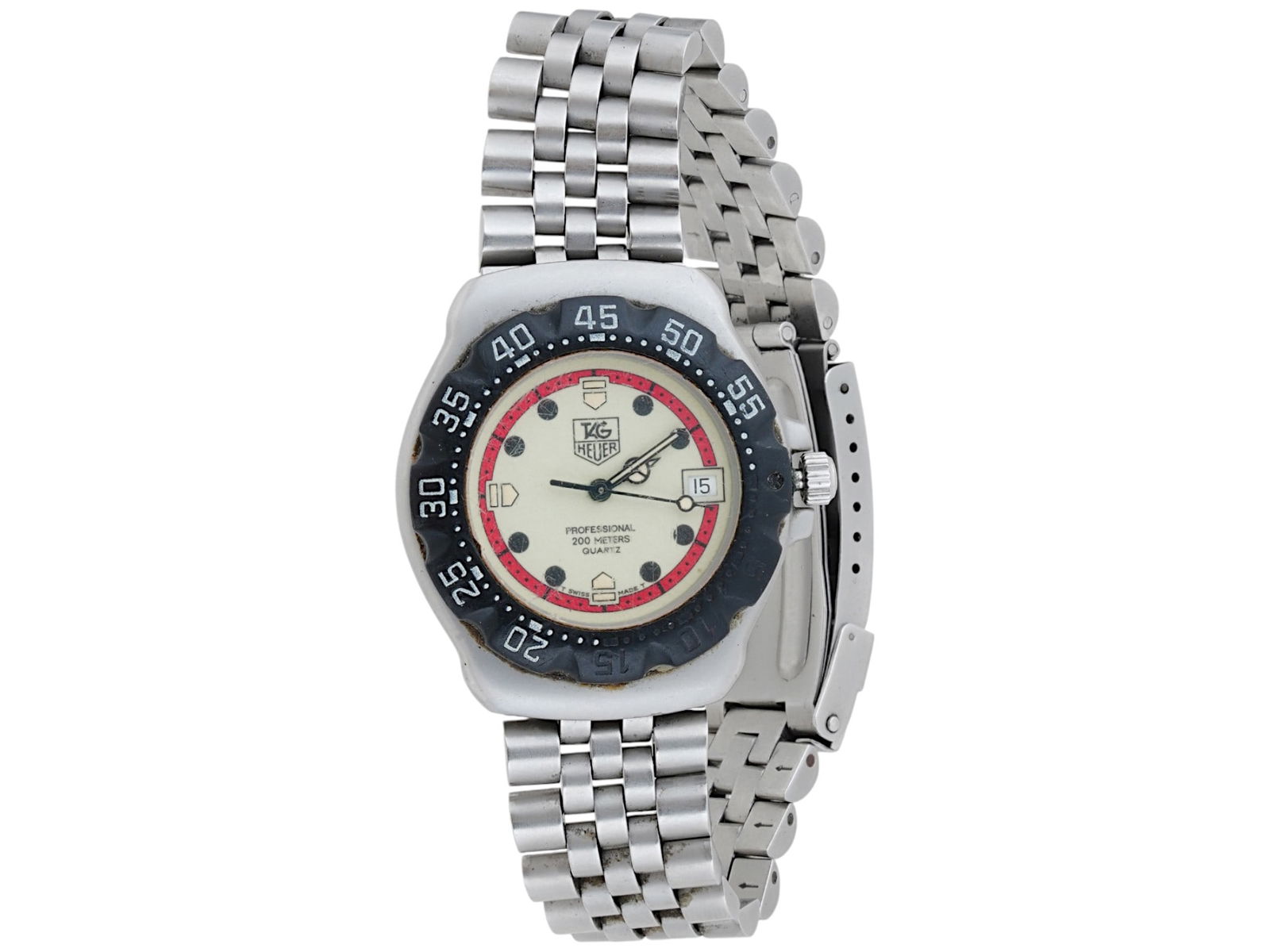 VINTAGE SWISS TAG HEUER FORMULA 1 QUARTZ WRIST WATCH: A vintage Swiss Tag Heuer Professional Formula 1 quartz wrist watch. Circa 1990s. The watch has a stainless steel case and bracelet and white dial without numbers marked Tag Heuer, Professional 200 me