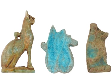 THREE ANCIENT EGYPTIAN FAIENCE AND STONE AMULETS