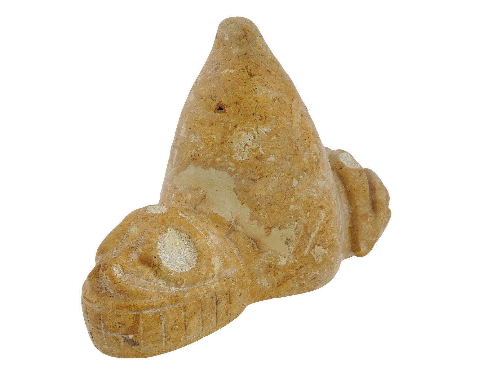 LARGE ANCIENT TAINO ARAWAK TRIGONOLITO ZEMI IDOL: A large ancient Pre Columbian Taino Zemi figure. Depicting a three-cornered shape with a smiling face on the one side and legs on the other side with a pointed central part. Known as Zemi idol or Trig