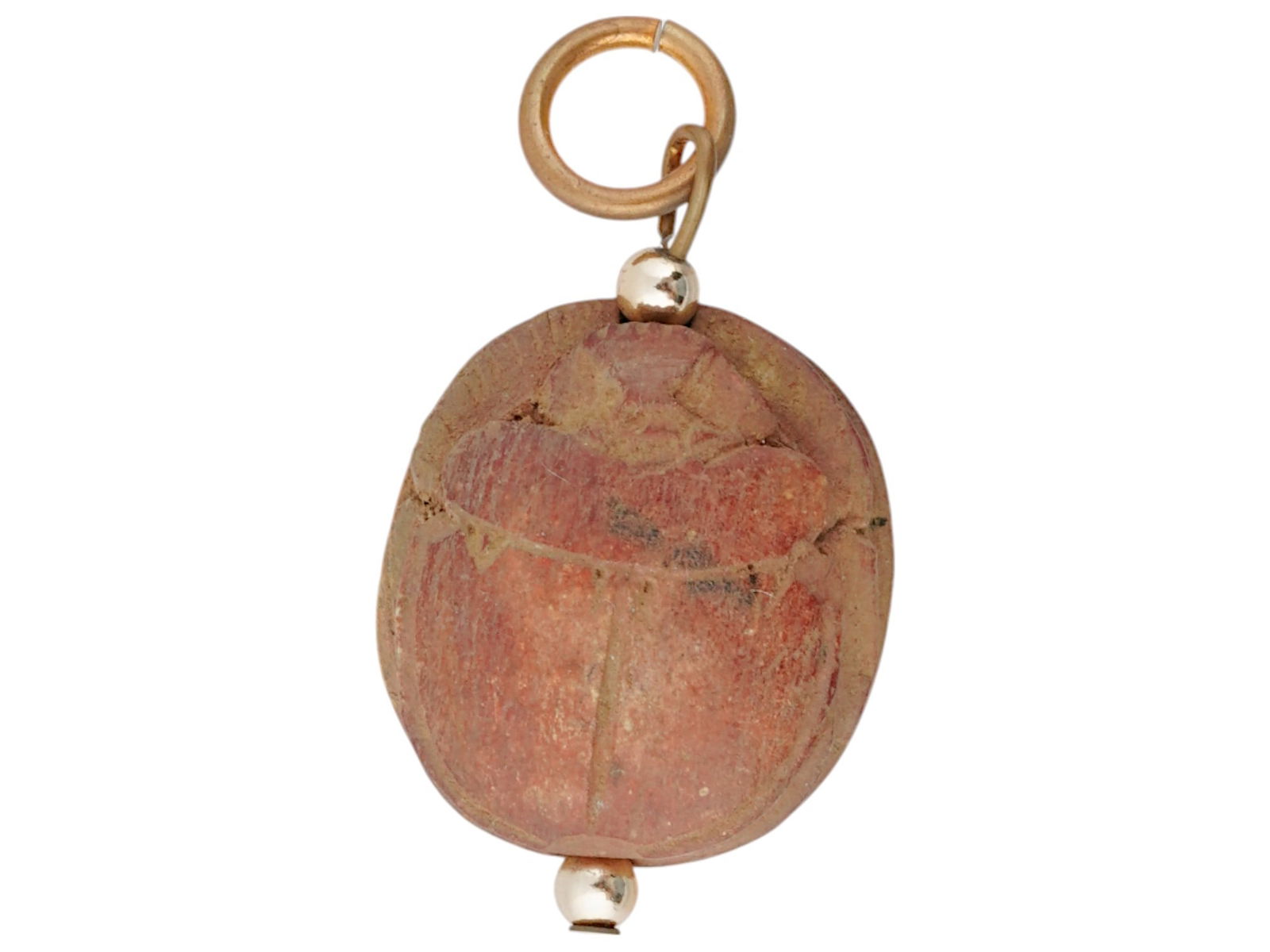 ANCIENT EGYPTIAN LIMESTONE SCARAB SEAL PENDANT: An Ancient Egyptian hand-carved limestone scarab seal bead in modern charm fittings. 18th Dynasty, 1570-1342 BC. The stamp features a hieroglyphical inscription. In Egyptian mythology, scarabs symboli