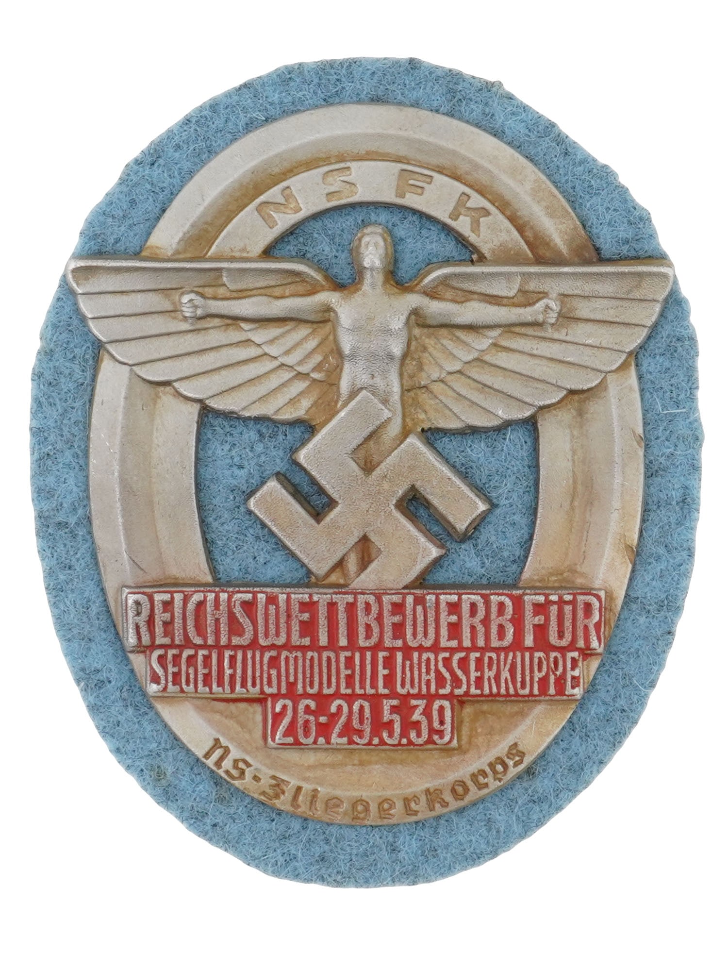 WWII MODEL NAZI GERMAN THIRD REICH NSFK SHIELD: A WWII model Nazi German Third Reich NSFK shield. The 1939 National Socialist Flyers Corps Reichswettbewerb fur Segelflugmodelle, National Competition of Gliding Model Planes in Wasserkuppe badge is a