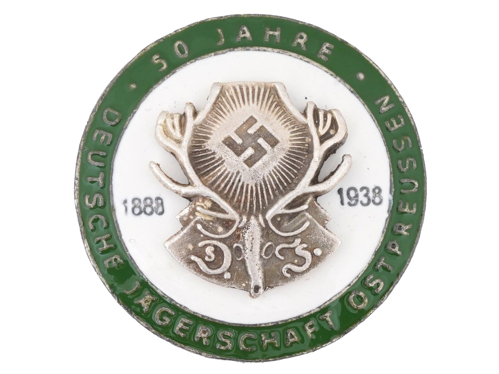 PRE WWII NAZI GERMAN BADGE 50 YEARS HUNTING ASSOCIATION: A pre WWII Nazi German badge, commemorating the 50th anniversary of the Deutsche Jagerschaft, German Hunting Association, from 1888 to 1938, specific to East Prussia, Ostpreussen. The circular badge f