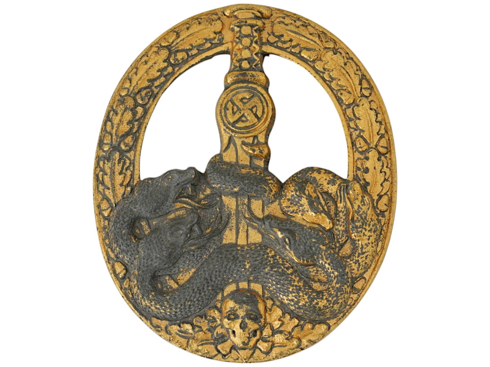 WWII NAZI GERMAN ANTI PARTISAN GOLD WASHED ZINC BADGE: A WWII Nazi German Army Anti Partisan gold washed zinc badge issued for officer uniforms. Features a dramatic design of six snakes coiled around a sword blade, symbolizing the suppression of enemy for