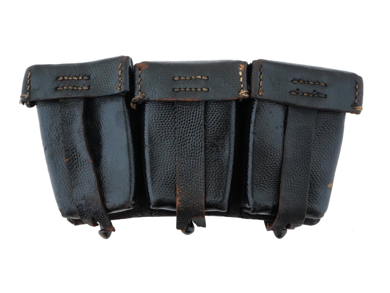 WWII GERMAN MAUSER K98 RIFLE LEATHER AMMUNITION POUCH: A WWII German Mauser K98 rifle pouch, crafted from black leather with white stitching. The pouch features three pockets for ammunition storage, each secured by flaps. It has two belt loops, which are 