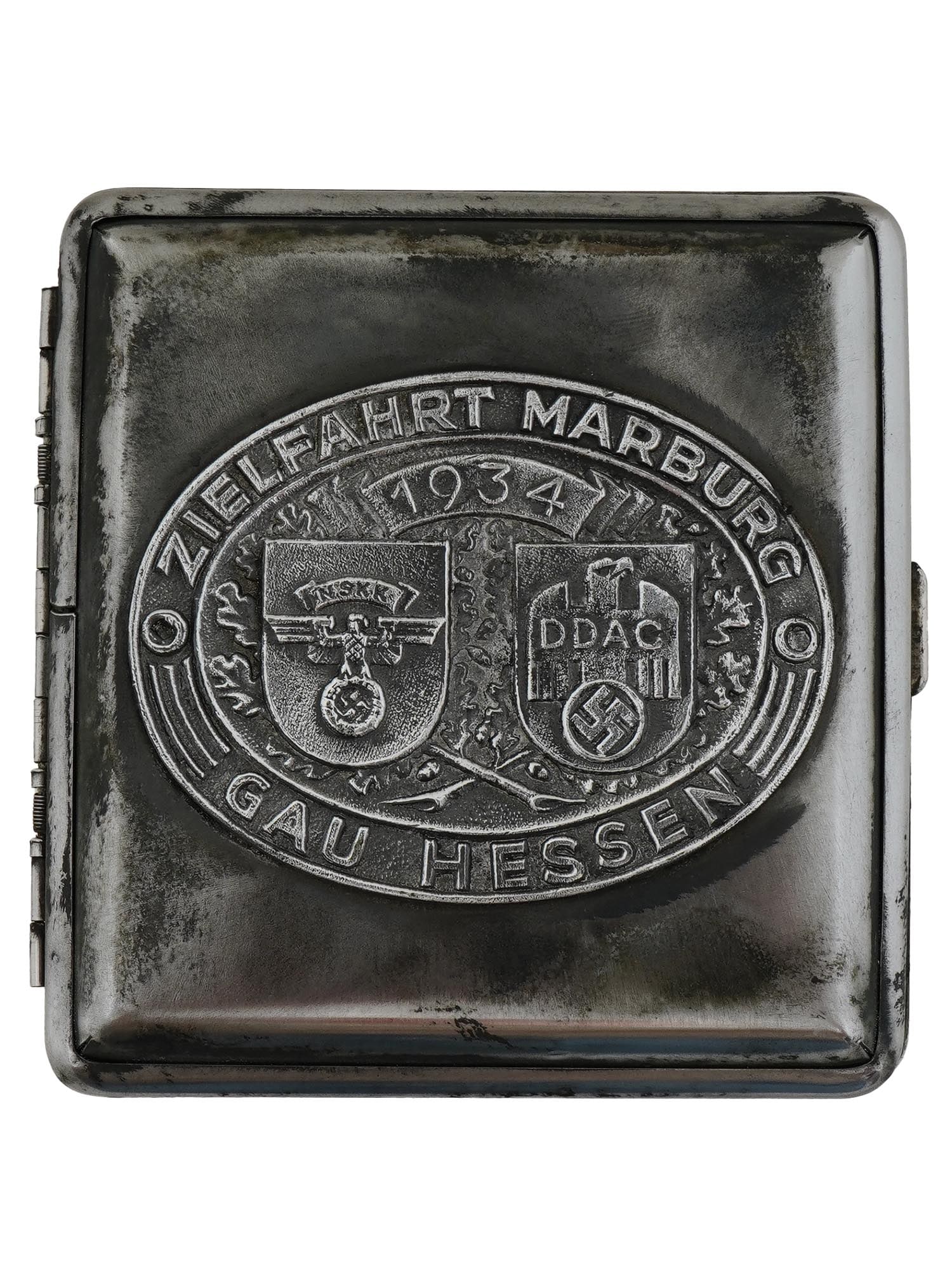 NAZI GERMAN THIRD REICH 1934 NSKK CIGARETTE CASE: A Nazi German stainless steel cigarette case. The front cover is decorated with embossed NSKK DDAC emblems and inscription Zielfahrt Marburg Gau Hessen 1934. Two holders inside the case are marked SS