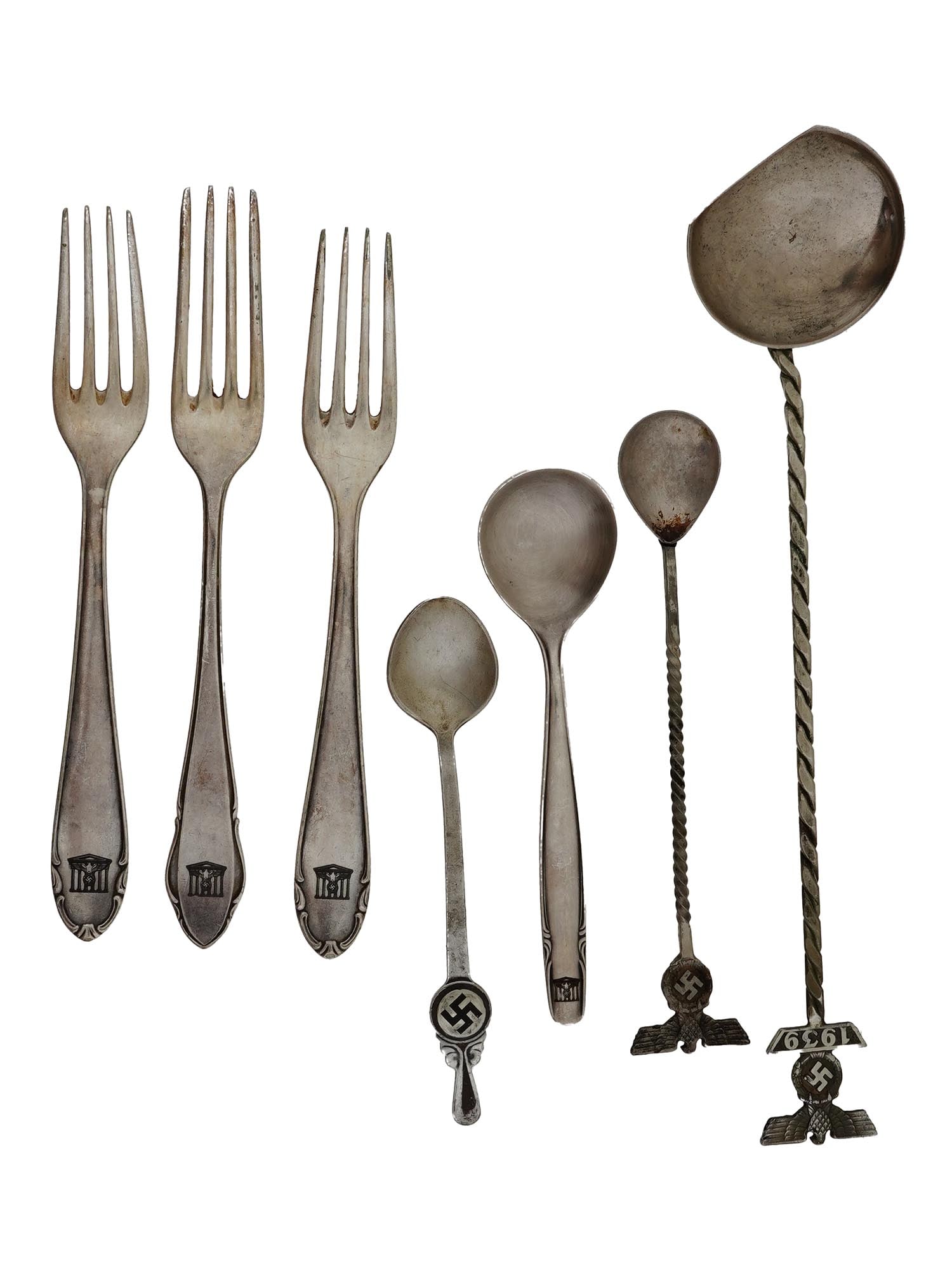 WWII GERMAN ASSORTED FORKS AND SPOONS F CANTEENS: A group of seven WWII Nazi German assorted forks and spoons from the canteens. The forks are the same size and make up a set, the spoons are different shapes and sizes. The tops are decorated with a f