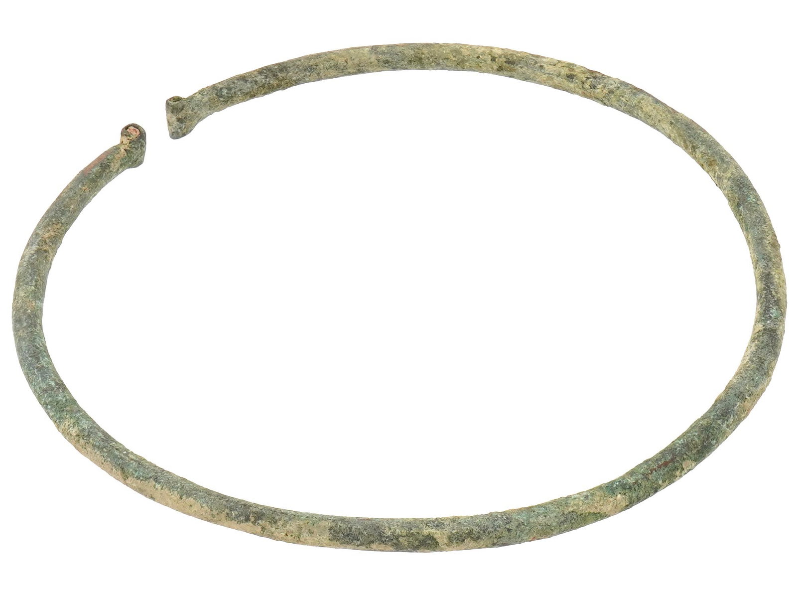 ANCIENT CELTIC BRONZE TORC 100 TO 200 BC: An ancient Celtic bronze torc or a neck ring covered with a green patina. The torc is circular with rounded terminals at each end. Circa: 100 to 200 BC. Museum Pieces, Ancient and Antique Celtic Bronz