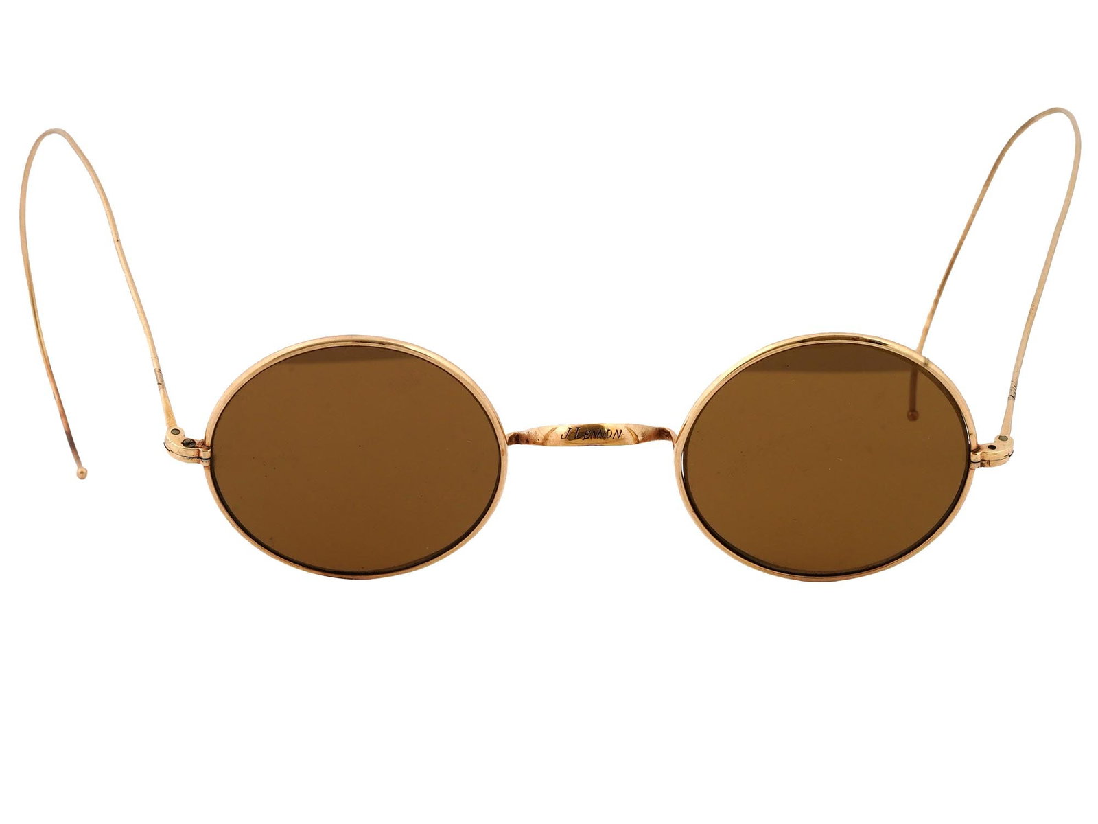 GOLD PLATED JOHN LENNON BEATLES MANNER ETCHED GLASSES: Gold plated John Lennon manner glasses featuring a stylish and iconic oval shape reminiscent of the legendary musician's signature look. Etched, J. Lennon, on a bridge. Dark tinted lenses. John Winsto