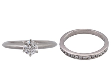 LOT OF TWO TIFFANY AND CO PLATINUM RINGS WITH DIAMONDS