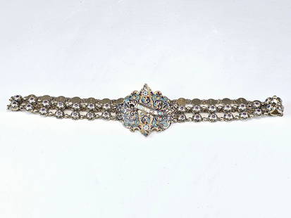 9TH C RUSSIAN GILT SILVER CLOISONNE ENAMEL BELT: An antique Russian silver cloisonne enamel belt. A buckle of two parts is connected with a Cossack dagger in the middle and surrounded by cloisonne enamel floral design. The 19th century. The belt con