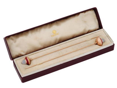 PAIR OF 56 RUSSIAN GOLD MOONSTONE PURPURIN HAIR PINS: A pair of Russian gold hair pins, each adorned with moonstones set in purpurin rings, in gold fittings crowning the top. These hair pins resonate with the elegance of Russia, merging the mystical allu