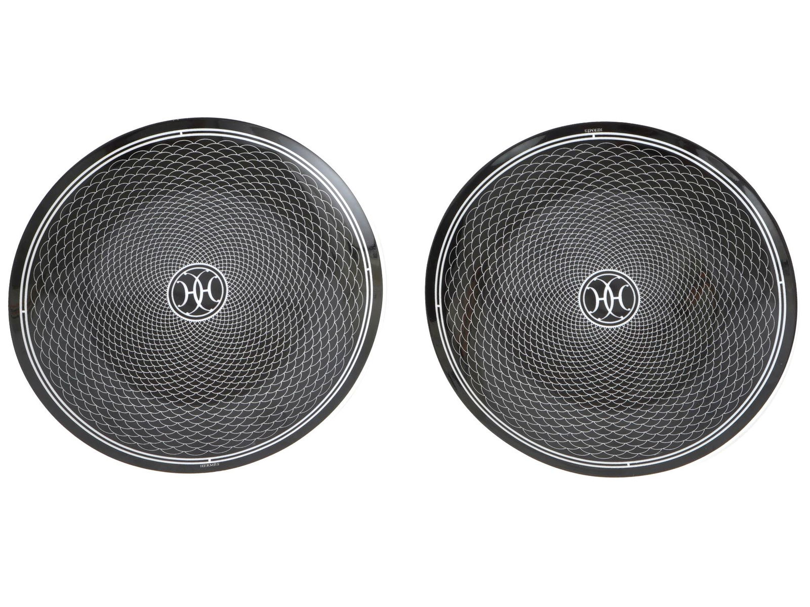 VINTAGE HERMES H DECO PORCELAIN DESSERT PLATES: A pair of vintage porcelain dinner plates by Hermes. H Deco collection. Screen printed black and white ornament. Hallmarked on the bottom. Inspired by the Art Deco ironwork of Hermes Parisian stores,