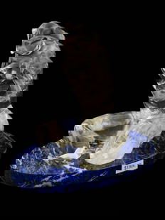 LIVIO SEGUSO MANNER ROCK CRYSTAL TORSO ON LAPIS BASE: A Livio Seguso manner rock crystal figure depicting a male torso. The torso is presented on an oval shaped Lapis Lazuli base. Livio Seguso is a 20th century Italian sculptor, known for Sculpture. Segu