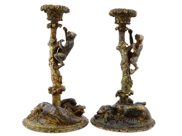 A PAIR OF ANTIQUE BRONZE CANDLESTICKS WITH MONKEYS