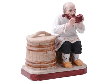 A RUSSIAN FIGURE OF A PEASANT, GARDNER PORCELAIN FACTORY, 1870S