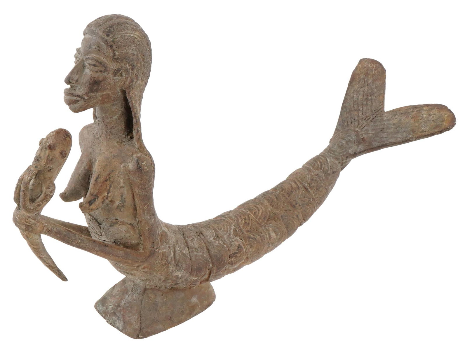 WEST AFRICAN DOGON TRIBE BRONZE MERMAID FIGURINE: A West African Dogon tribe stylized bronze tribal figurine. The figurine depicts a mermaid holding a baby in her hands, engraved with detailed patterns. Mounted on a stand. Circa: 1800 AD. African Scu