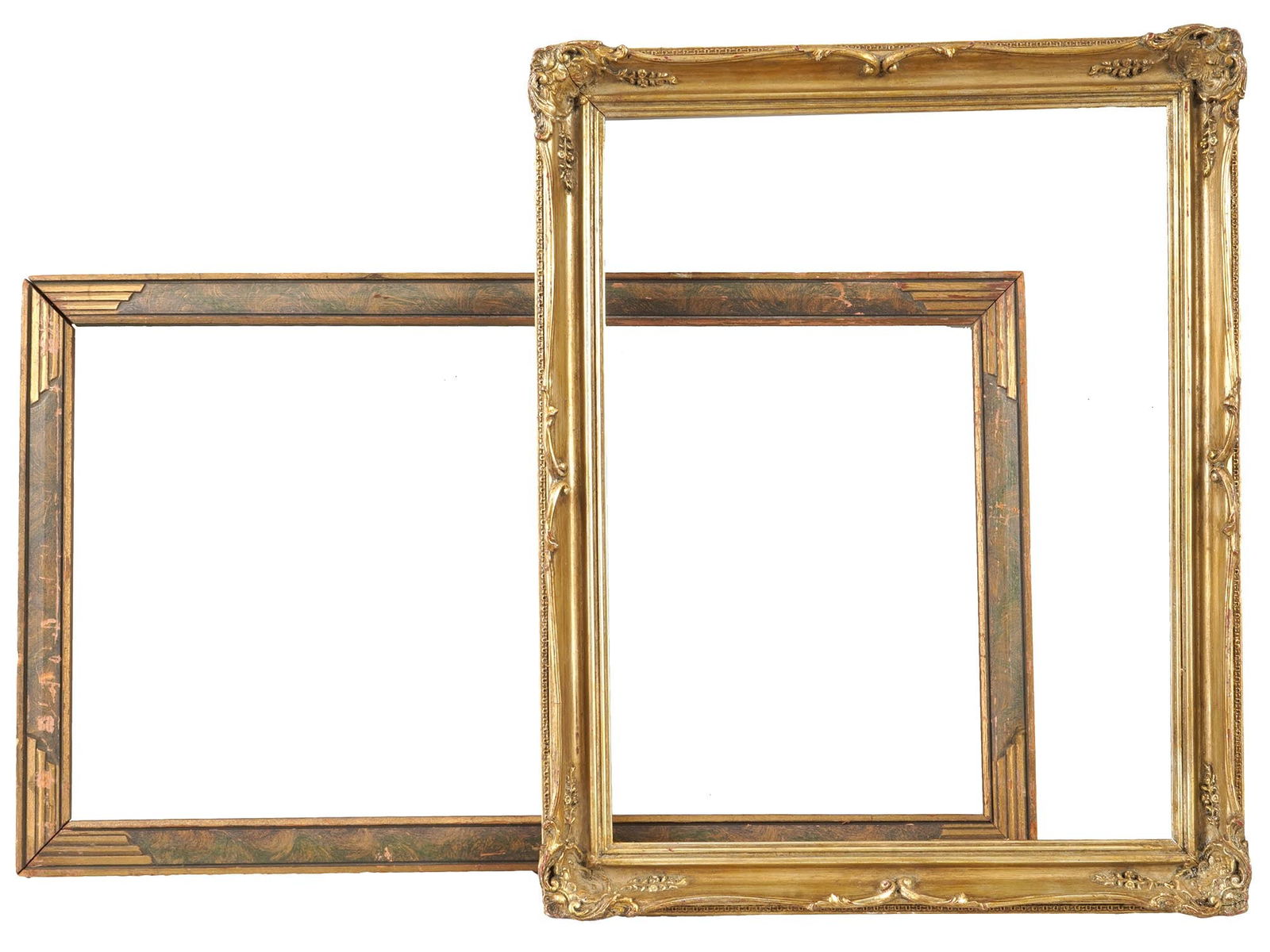 PAIR OF ANTIQUE GILT WOOD PICTURE FRAMES: A pair of antique early to mid 20th century gilt wood picture frames. The first frame is of an elongated format, decorated in the Art Deco manner. The second frame has a gilt carved flower motifs deco