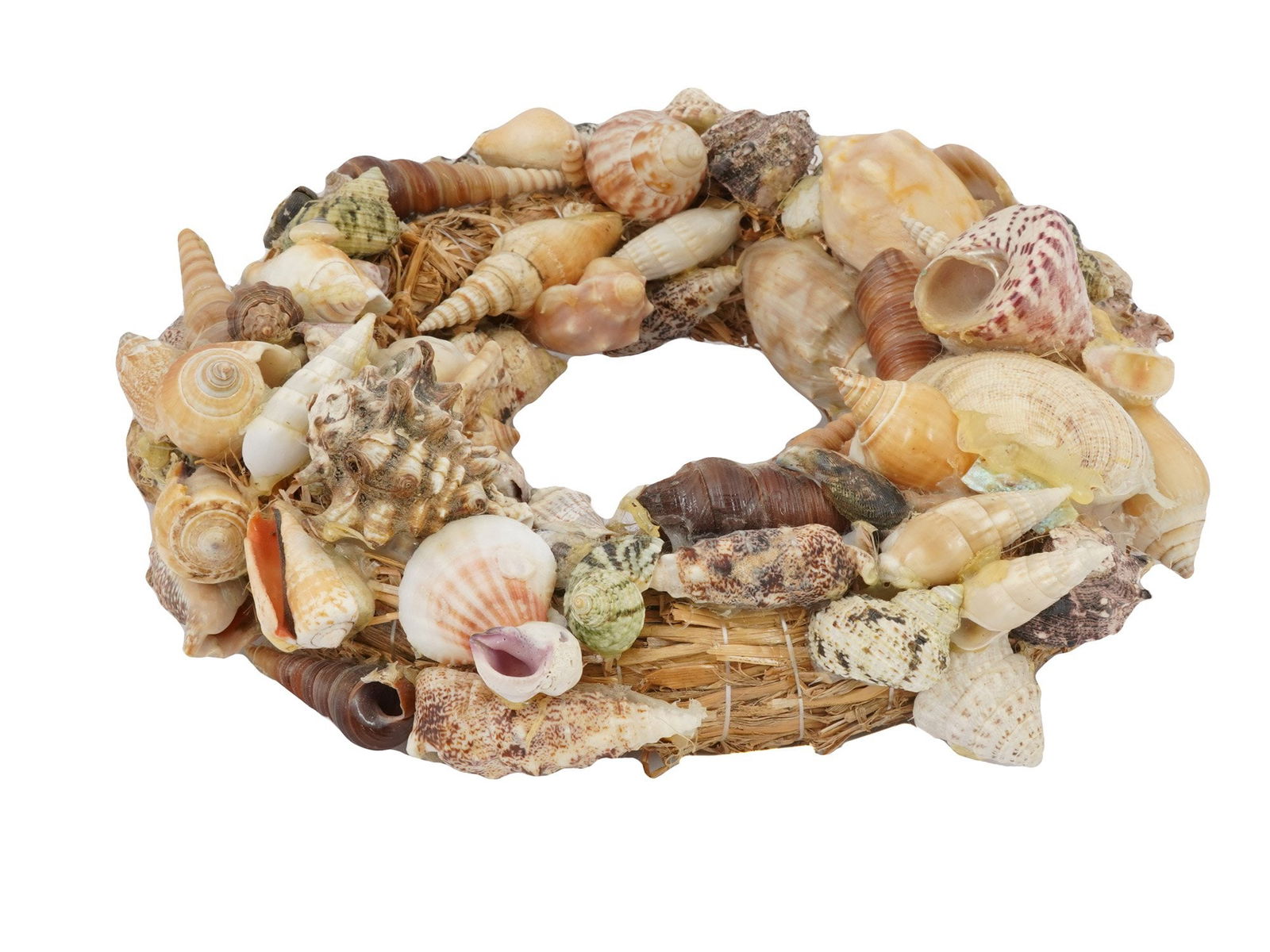 VTG NAUTICAL MARINE HANDMADE SEASHELL WALL DECOR: A vintage nautical themed handmade seashell wall decor. The seashells are densely packed and arranged in a circular or wreath like formation. The shells vary in size, shape, and color. Nautical And Ma