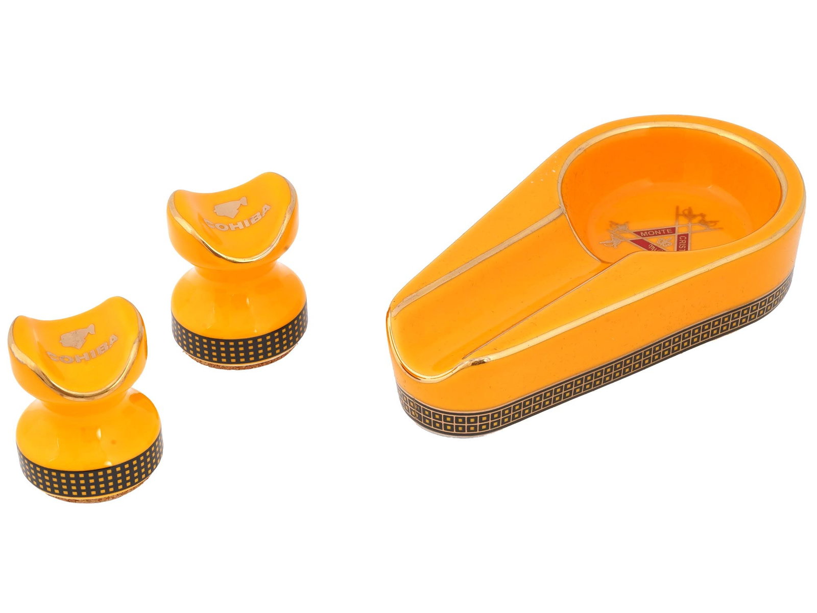MONTECRISTO CERAMIC ASHTRAY AND COHIBA CIGAR STANDS: A lot of cigar smoking accessories, a ceramic ashtray by Jihuang Montecristo and a pair of ceramic cigar rests by Cohiba. Matching design, orange ground color with gilt rims and geometric borders. Col