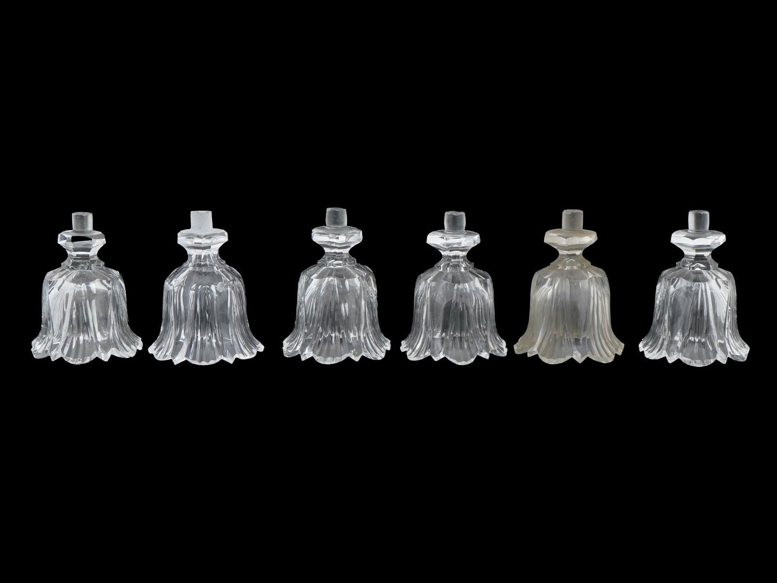 LOT OF SIX CLEAR GLASS CHANDELIER PARTS: A lot of six clear glass pieces, possibly bobeches, parts of a chandelier or light fixture. Floral shape with fluted details. Collectible Glassware, Interior Decor Accessories.THIS LOT QUALIFIES FOR A