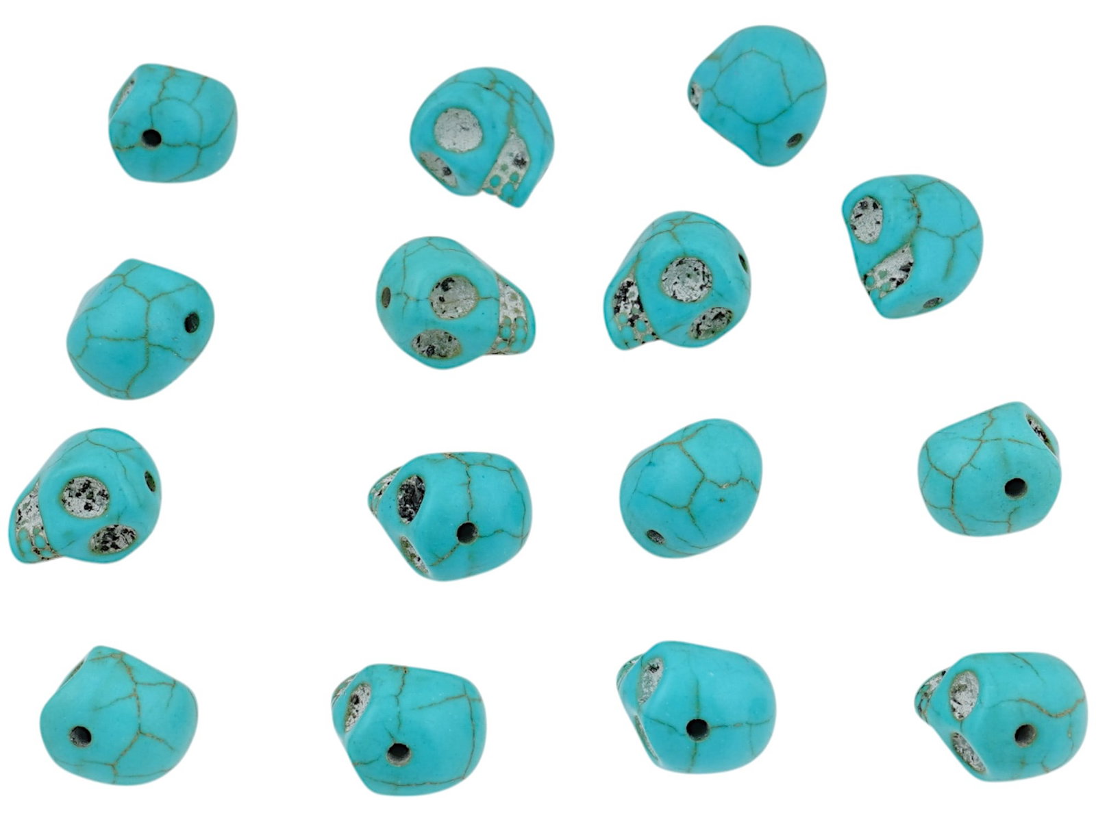 COLLECTION OF SKULL SHAPED TURQUOISE STONE BEADS: A collection of carved turquoise stone figural beads. The beads are made in the skull design, engraved with detailed patterns. Vintage Carved Stone Beads, Jewelry Wares and Accessories For Collectors.