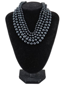COLLECTION OF ASSORTED CARVED ONYX BEADS STRINGS