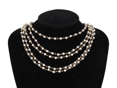 SET OF PLASTIC PEARL BEADS LINKED TOGETHER WITH CHAINS