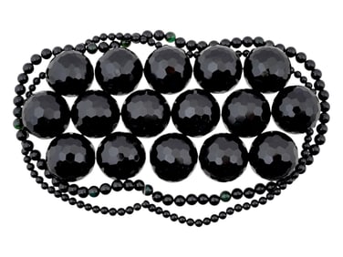 COLLECTION OF ASSORTED CARVED ONYX BEADS STRINGS