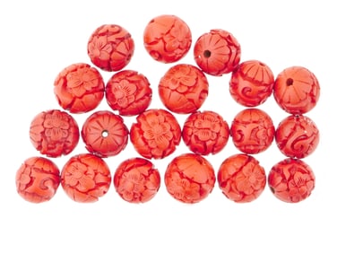 COLLECTION OF CHINESE CARVED CINNABAR MANNER BEADS