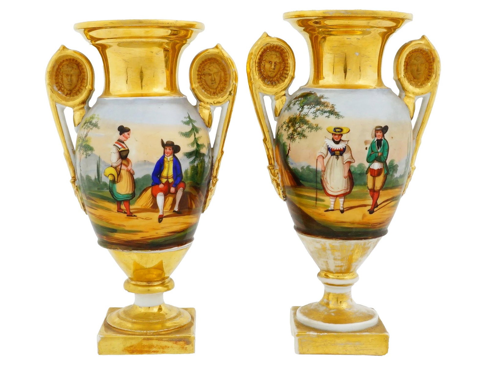 ANTIQUE FRENCH EMPIRE OLD PARIS PAINTED PORCELAIN VASES: A pair of antique French Empire painted porcelain vases, dating to the 19th century, attributed to Old Paris. Each vase features a hand-painted and gilded scene depicting characters engaged in everyda