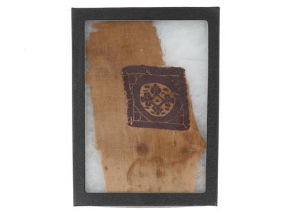 400 TO 500 AD ANCIENT EGYPTIAN LINEN FRAGMENT W CROSS: An ancient Egyptian linen fragment. The fragment depicts a hand woven Coptic cross in a rectangular shaped frame. Circa; 400 to 500 AD. Framed. Ancient and Antique Historical Collectibles And Archaeol