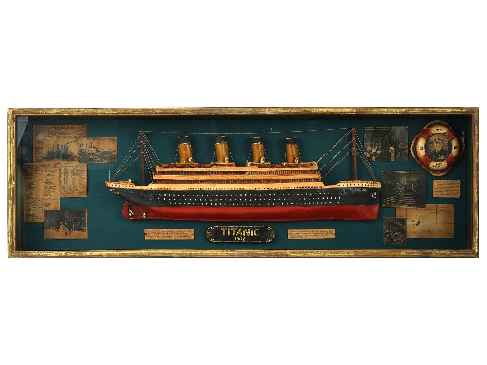 VINTAGE 1912 TITANIC MODEL SHIP IN GLASS SHADOW BOX: A vintage 1912 Titanic model ship memorabilia. Presented in a wooden and glass shadow box. Materials: wood, metal, paper, glass, plastic. The background is adorned with newspaper front pages and photo