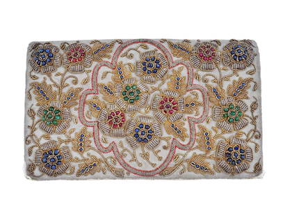 VINTAGE HAND EMBROIDERED METALLIC THREADS BEADS BAG: A vintage French manner hand embroidered with metallic threads and jeweled purse bag. The is adorned with floral and foliage ornaments, and decorated with assorted beads in sapphire, ruby and emerald