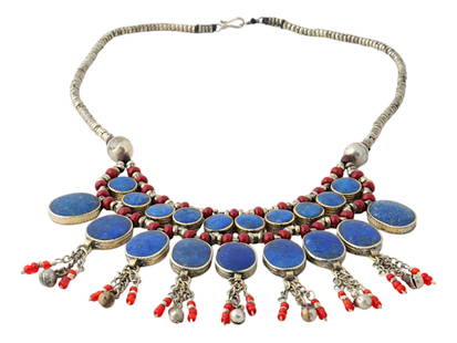 MIDDLE EASTERN AFGHAN HAND MADE LAPIS LAZULI NECKLACE: A Middle Eastern Afghan jewelry necklace in antique setting. The necklace is made in a multilayered design. The necklace features a captivating array of deep blue lapis lazuli stone. The necklace is d