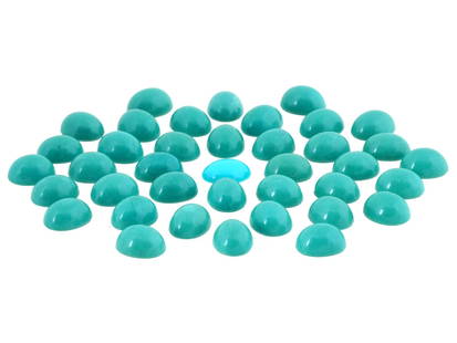 COLLECTION OF CABOCHON CUT TURQUOISE BEADS: A collection of cabochon cut turquoise beads. The beads are uniformly shaped, with a smooth, domed surface typical of cabochon cutting. They are a consistent, light to medium teal or blue green color.