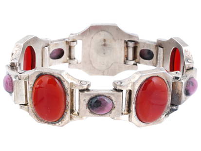 ART DECO STERLING SILVER AGATE RHODONITE BRACELET: An Art Deco manner Sterling Silver jewelry bracelet. The bracelet is made in a link design. The bracelet is encrusted with oval cut Agate and Rhodonite stones. Marked with a Sterling Silver hallmark.